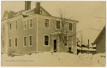 This image is part of the Thompson Family of Canaan Valley Collection. The Thompson family played a large role in the timber industry of Tucker County during the 1800s, and later prospered in the region as farmers, business owners, and prominent members of the Canaan Valley community.The snow-covered house was the company house located on the corner of 4th Street and Henry Avenue in Davis, W. Va.