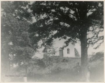 Hedding Chapel Methodist Church was organized in 1856. The present building was dedicated in August 1893.On the back of the image, a caption reads: "This picture was taken in about 1912 -- 15  years before route 19 was graded through church [lot].  To Ruth Alkire Smith, from your Sunday School Teacher, Helen Sprigg. Christmas, 1956."