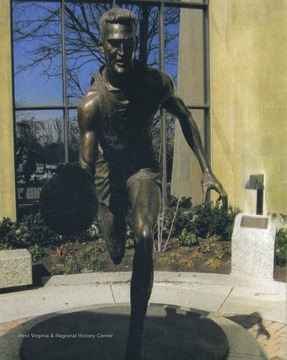 Sculpted by Jamie Lester, the statue was unveiled February 14, 2007 and stands outside the West Virginia University Coliseum. 