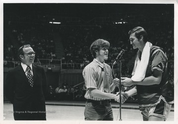 Jerry West presents the first annual Jerry West Scholarship to Kenneth Tawney of Spencer, W. Va. Tawney attended WVU, subsequently earning a law degree.