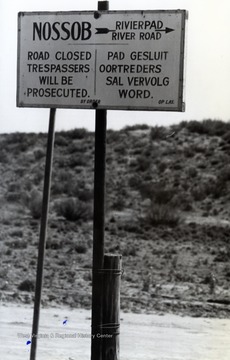 A trespassing notice printed in English and Afrikaans, South Africa.    