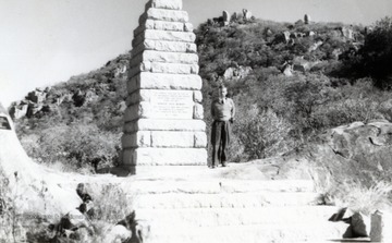 Edward C. Tabler standing beside the Pioneer Monument in Zimbabwe, Africa.  