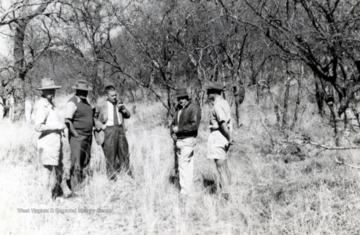 Edward C. Tabler and other individuals on the Hunter’s Road, Zimbabwe, Africa.