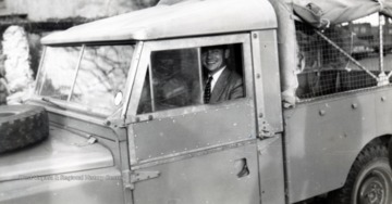 Edward C. Tabler in a vehicle, preparing to depart Stokestown, Zimbabwe, Africa. 