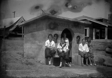 A group of unidentified girls are pictured outside of the spring site. 