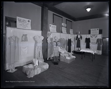 An exhibition of dresses and fashion are on display in an unidentified location. 