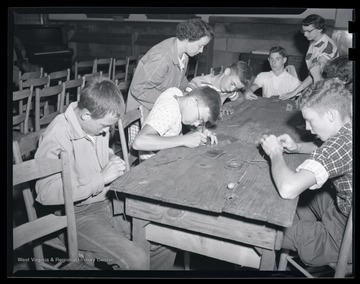 A group of unidentified boys participate in the class activity.