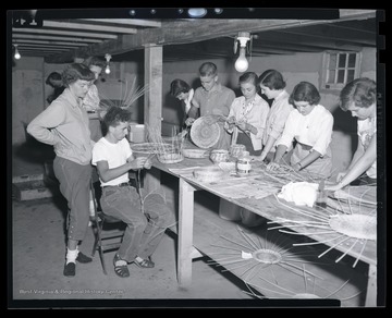 A group of campers work together during the class activity. Subjects unidentified. 