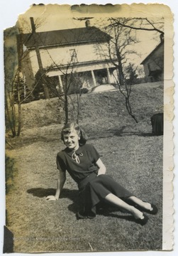 DeWitt relaxes on the grass during her senior year at Terra Alta High School. 