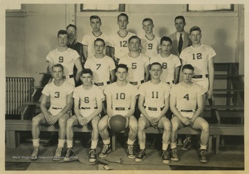 In the first row, from left to right, is: Paul Cooper; Richard Fraley; Ronald Everly; Robert Harmon; Jack Hill.In the second row, from left to right, is: Don Groves; Frank Lambert; David Metheny; Clifford Lambert; Charles Glotfelty.In the third row, from left to right, is: Robert Feather (manager); Lawrence Smith; Eugene Auman; Arthur Sisler, Coach Fred C. Carrol. 