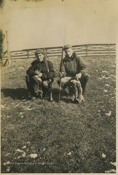Terra Alta High School students Paul Cooper Jr. and "Weed" Arthur Sisler pose together with the rabbits they successfully hunetd. 