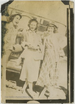 Josephine Kisner, center, laughs with her two unidentified classmates. 