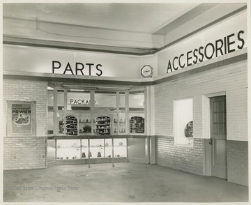 Interior of an automotive store featuring parts and accessories for Packard cars.  Likely in Morgantown, W. Va.