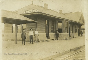 Lawrence Perry, husband of Louise Edith Stephens, is pictured with associates outside of the train depot. Louise Edith is the daughter of Stacy Stephens, who was the son of Thomas Stephens. 