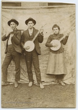 Stephens and his unidentified associates are pictured holding instruments. John is the son of Stacy Stephens, who was the son of Thomas Stephens. 