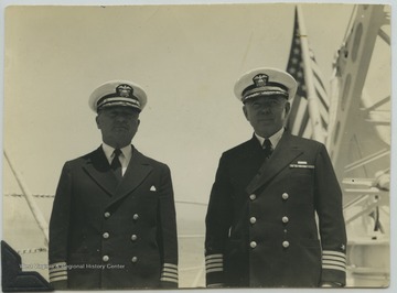 The old captain of the ship, William R. Furlong (right), stands beside the new captain of the ship, William O. Spears (left). 