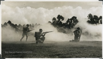 A group of soldiers practice firing. Photograph comes from a U.S.S. West Virginia scrapbook.