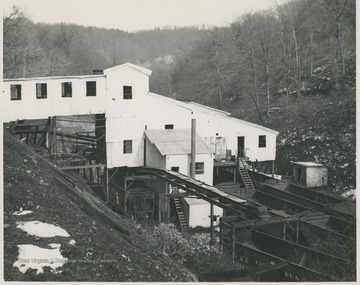 View overlooking the facilities in Cameo, W. Va. C. & O. Railway cars sit around and beneath the building, likely ready to transport coal.