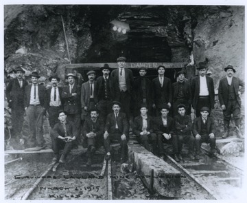 The nineteen survivors of the Layland mine explosion are pictured together outside of the mine entrance. The accident left 112 miners dead. The mine was operated by the New River and Pocahontas Consolidated Coal Company.