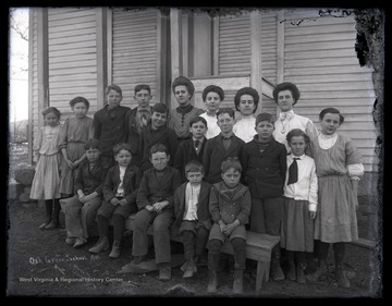 A group of school children and teachers pose outside of the school building located in Pendleton County, W. Va.