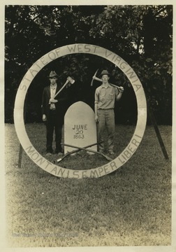 The two men in the picture re-create the West Virginia state seal, likely at the state 4-H camp in Jackson's Mill.