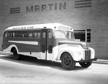 A bus supplied by Mountain State Equipment Company is used for "Mack's Bus Line" in an unidentified location. 