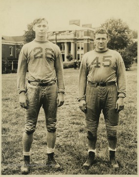 Two unidentified players are pictured on the practice field. 