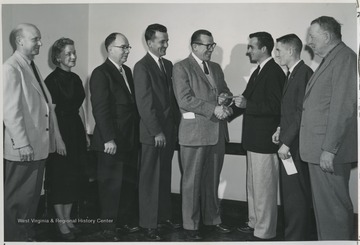 Left to Right: C.P. Dorsey, Mrs. Mary Rose Jones, Dr. A.H. VanLandingham, G. W. Melvin, M.F. Kennedy, Edwin Townsend, John Wolfenberger, and J.O. Knapp.
