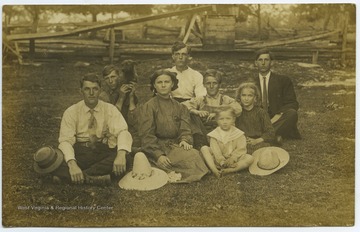 Walter (left) is pictured sitting with members of the Groves family. 