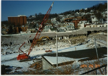 View of demolition progress, with Sunnyside neighborhood visible in the background.