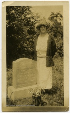 Lucy Satterfield at the grave of Glenn Edwards, her son.