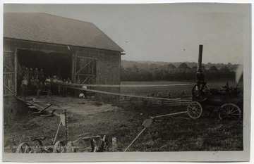 Barn and tractor on farm.