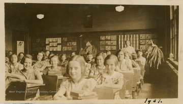 Photo of students at desks in classroom, likely taken in March, 1907.