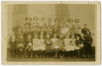The students of the Easton School pose outside of the school building, located in Easton, near Morgantown, W. Va.