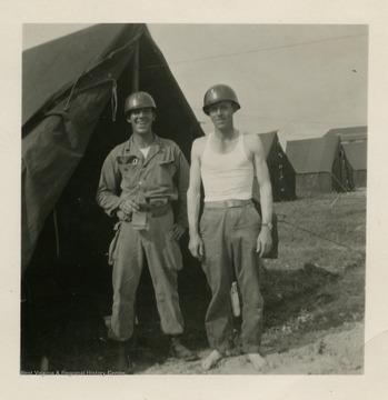From left to right: Giles, Van Trail standing outside of tent.