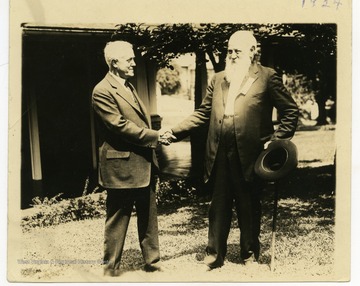 John William Davis shakes hands with Mr. Johnson from Bridgeport.