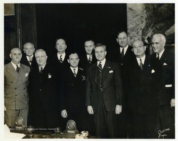 Pictured left to right: Ray Murphy, Ed Spafford, Ralph T. O'Neill, General James A. Drain, Stephen Chadwick, Harry Colmery, Raymond J. Kelly, John R. Quinn, Louis Johnson, Paul McNutt. 