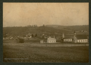 A view of Bruceton Mills, showing the town's schoolhouse and churches in the foreground.