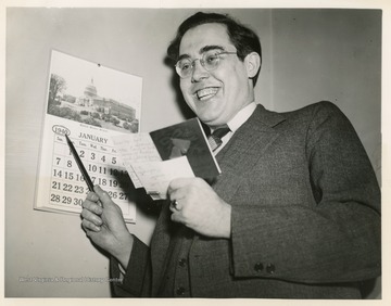 Holt holds a "greeting card and offer of marriage he received in his Washington office."