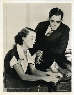 Text on back reads, "Washington, D. C.: Rush Holt, 29-year-old senator-elect, of West Virginia, is shown here with his charming sister Jane, at their Washington home. Deprived by his age of the right to speak in the Senate, Senator Holt will make a speaking tour of several states, marking time until June 19th, when he reaches the...minimum (age)."