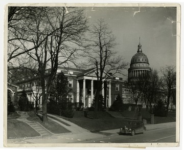 A view of the Governor's mansion showing the capitol building in the background. 