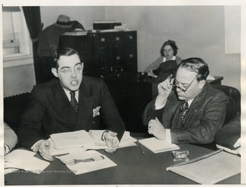 "Senator Rush D. Holt, of W. Va., is pictured testifying on conditions at Gauley Bridge, W. Va., which are being investigated by the House Subcommittee on Labor, In Washington D.C. on January 22. Chairman Glenn Griswold, of Indiana, is shown on right." Holt directed an attack on the contractors, the Rhinehart and Dennis Company of Charlottesville, Virginia.