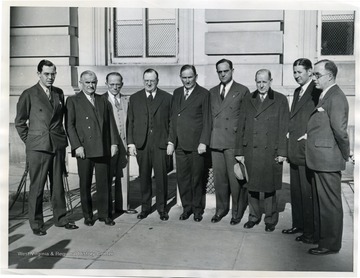 Newly elected U.S. Senators pose on the Capitol steps with Joseph T. Robinson (D., Ark.) and majority floor leaders left to right, Rush D. Holt, (D., W. Va.) Joseph F. Guffey, (D., Pa.) Theodore G. Bilbo, (D., Miss.); Francis T. Maloney, (D., Conn.) Joseph T. Robinson, (D., Ark) and Majority Floor Leader; Sherman Minton, (D., Ind.) George L. Radcliffe, (D., MD.); James E. Murray, (D., Mont.) and Lewis B. Schwellenbach, (D., Wash.).