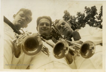 Back of photo reads: "Trumpet Sec of band 17. (left to right) Me, Bill, Max. Bill and I have the same kind of trumpet, Max is an outcast, he has an 'Old'r.'"