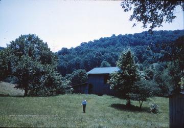 Leonard "Lennie" Dotson is pictured outside the barn on his farm.