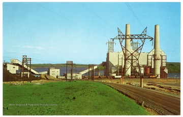 Text on the back reads, "Mine Mouth Generating Station, at Mt. Storm, W. Va., provides power to the free world's first 500,000 volt transmission system."