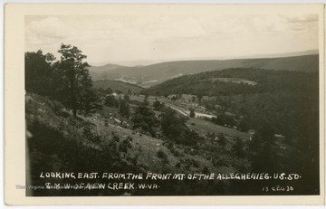 The caption reads, "A view looking east from the front Mt. of the Alleghenies. U. S. 50. 8 miles west of New Creek, W. Va." 