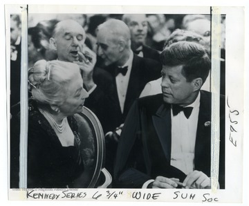 Caption on back reads: "Pearl Buck chatted with late President Kennedy at White House dinner for Nobel Prize winners in April 1962."