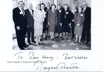 Rene Henry standing behind Lady Margaret Thatcher at William & Mary.