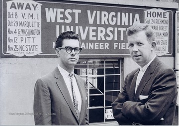 WVU broadcaster Jack Fleming(right) and sidekick at the Mountaineer Field athletic offices.